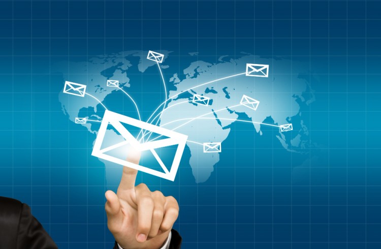 A Business Professional Touching a Digital Envelope Icon, Representing Global Email or Transaction Processing