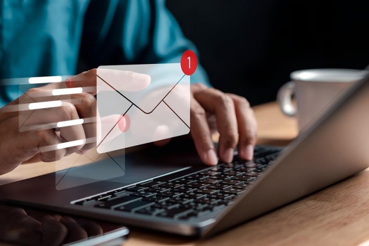 Secure Check Emailing and Mailing A Young Man Smiling at His Phone with Animated Envelope Icons, Indicating New Message Notifications