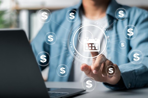 Automate Vendor Payments to Boost Business Efficiency A Person Interacting with a Digital Sales Dashboard with Dollar Signs and an E-Commerce Icon Floating Around