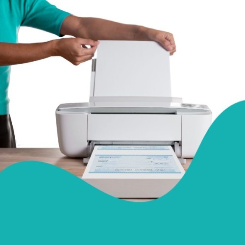A Person Loads Paper into a Printer While a Sheet with Light Blue Print Emerges from the Machine, Showcasing Printing in Action